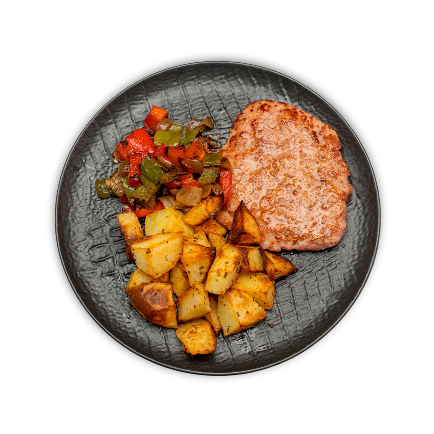 Carne de hamburguesa de pollo con patatas asadas y salteado manduca
