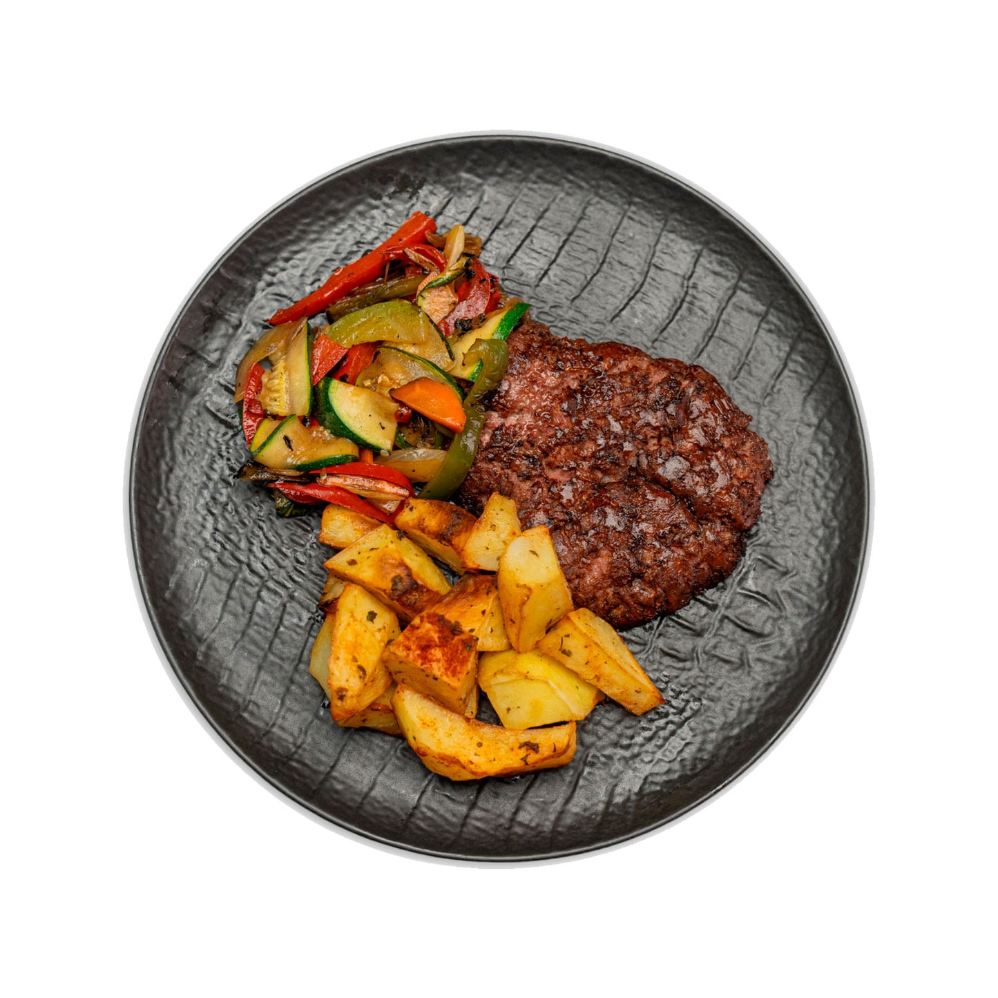 Hamburguesa de ternera con verduras y patatas asadas