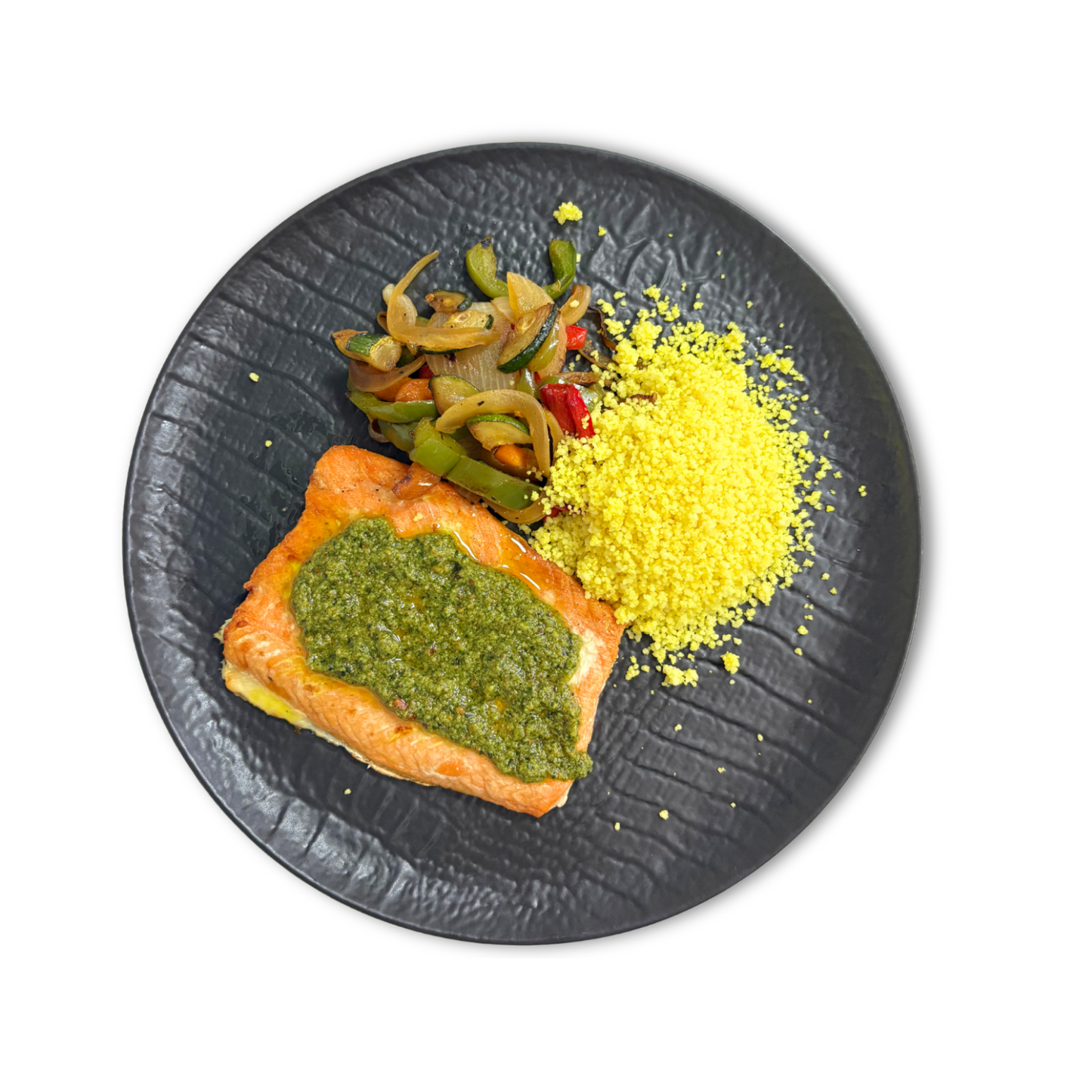 Salmón al pesto verde con cuscús y verduras salteadas
