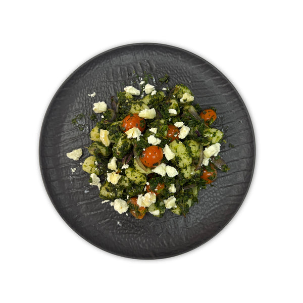 Ñoquis salteados con espinacas, tomate cherry y queso de cabra
